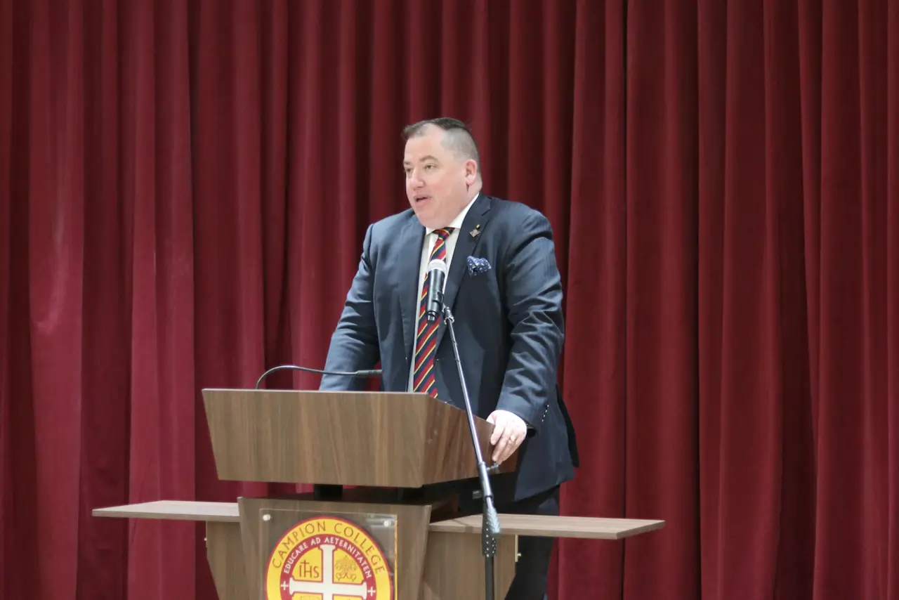 Mr Gray Connolly addresses students at Formal Hall